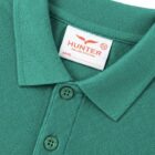 Collar detail of Emerald green Polo shirt by Hunter Schoolwear