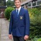Royal blue Boys stain resistant school blazer front view with classic three pocket desigN