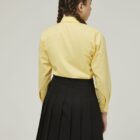 Back view of girls school blouse showing straight hem and fit