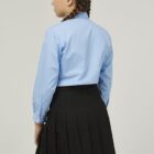 Back view of girls school blouse showing straight hem and fit
